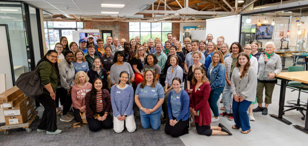 Posed, group photo of PA ELit Network members at the 2025 Teaching Green Symposium.