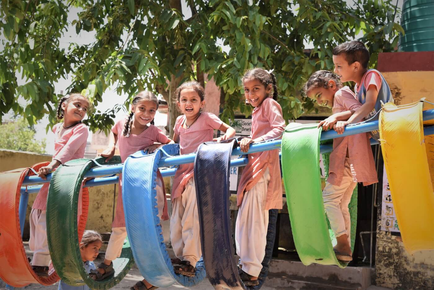 Smiling children on a playground in India